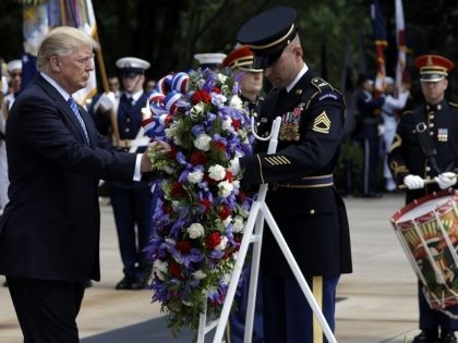 President Donald Trump participates in a wreath laying ceremony at Arlington National Ceme