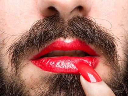Bearded Man with Red Lipstick on His Lips and Nail Polish