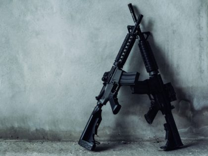 Double assault rifle on gray background, terrorist,robber concept.