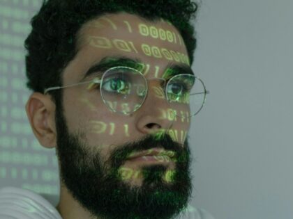 hacker with code on face