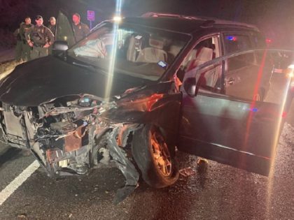 An alleged human smuggler and an illegal alien were injured when the driver crashed into a