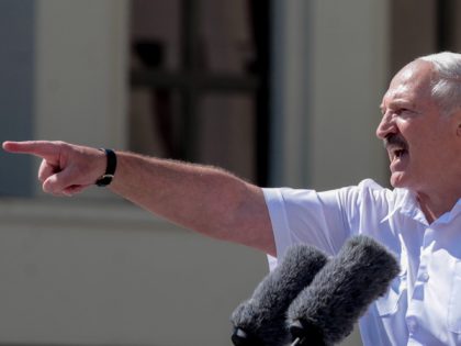 Belarus' President Alexander Lukashenko gestures as he delivers a speech during a rally he