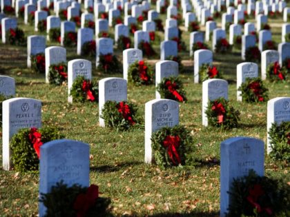 Wreaths grace headstones at Arlington National Cemetery as Wreaths Across America places r